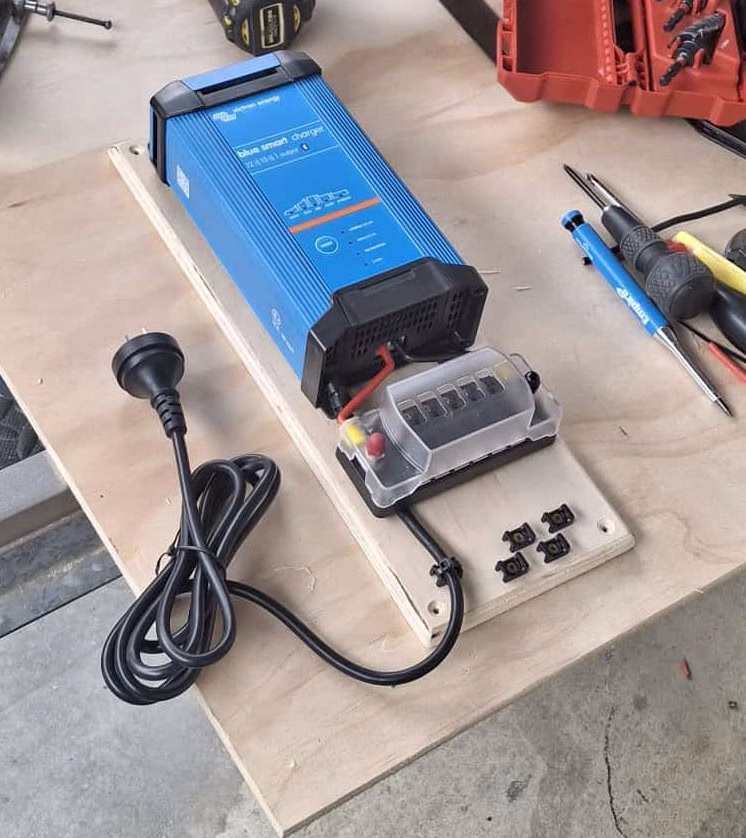 Caravan and RV set up with power at a campsite